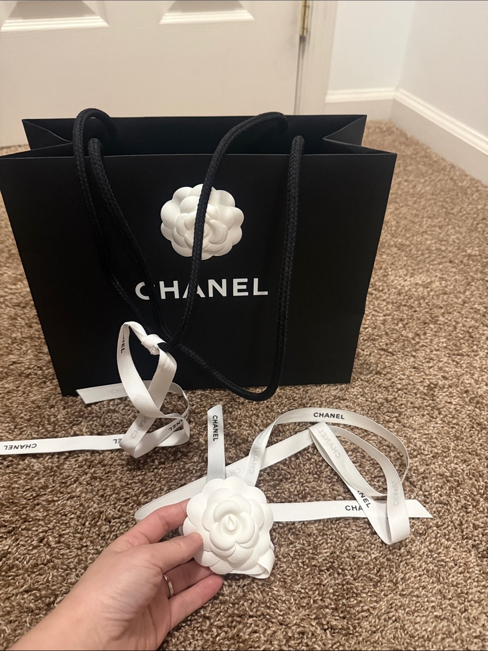 CHANEL Black Gift Bag with White Camellia and Ribbon Accent